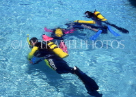 MALDIVE ISLANDS, scuba divers in shalow water, MAL475JPL