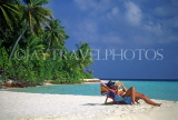 MALDIVE ISLANDS, sunbather on deckchair, beach and seascape, MAL144JPL
