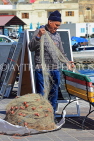 MALTA, Marsaxlokk, fishing village, fisherman sorting out fishing nets, MLT1051JPL