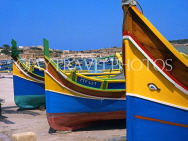 MALTA, Marsaxlokk, traditional fishing boats (Luzzus) lined up, MLT601JPL