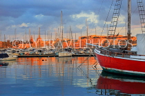 MALTA, Sliema, seafront, sunset and boats, view towards Valletta, MLT823JPL