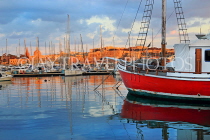 MALTA, Sliema, seafront, sunset and boats, view towards Valletta, MLT824JPL