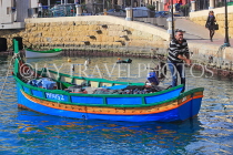 MALTA, St Julian's, fisherman in his boat (Luzzu), MLT1164JPL