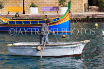 MALTA, St Julian's, man rowing a small boat, MLT1166JPL
