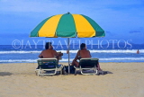 MARGARITA Island, El Agua Beach, couple with sunshade, MAR112JPL