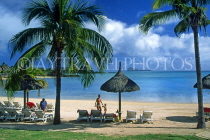 MAURITIUS, North East Coast, beach by Legends Hotel, coconut palms and sunshades, MRU351JPL