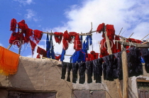 MOROCCO, Marrakesh, Medina (old town), coloured wool hung up to dry, MOR98JPL