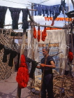 MOROCCO, Marrakesh, Medina (old town), man drying coloured wool, MOR308JPL