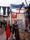 MOROCCO, Marrakesh, Medina (old town), man drying coloured wool, MOR313JPL