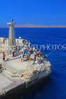 Malta, GOZO, people fishing off the breakwater, MLT724JPL