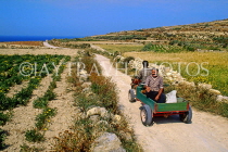 Malta, GOZO,farmer driving small tractor along country lane, MLT567JPL
