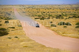 NAMIBIA, Damaraland, vehicle along empty road, NAM213JPL