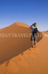 NAMIBIA, Sossusvlei National Park, climber on sand dune, NAM132JPL