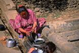 NEPAL, Kathmandu Valley, Changunarayan, woman scrubbing pots, NEP384JPL
