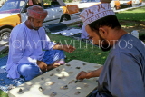 OMAN, Muscat, men playing tradional Omani boardgame, OMA518JPL
