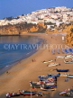 PORTUGAL, Algarve, ALBUFEIRA, beach with fishing boats, old town in background, POR419JPL