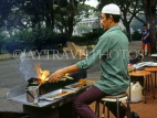 SINGAPORE, Hawker Centre, vendor cooking Sate, SIN140JPL