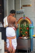 SINGAPORE, Little India, Sri Veeramakaliamman Temple, Hindu priest at shrine, SIN790JPL