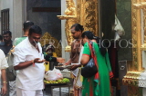 SINGAPORE, Little India, Sri Veeramakaliamman Temple, priest with worshippers, SIN800JPL