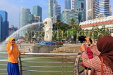 SINGAPORE, Marina Bay, Merlion Park, Merlion statue, tourist posing for photo, SIN1205PL