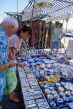 SPAIN, Andalucia, Costa Del Sol, ESTEPONA, sunday market, tourists at ceramics stall, SPN815JPL