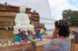 SRI LANKA, Anuradhapura, Mirisaweti dagaba (stupa), worshipper at shrine, SLK5639JPL