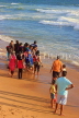 SRI LANKA, Colombo, Galle Face Green, people enjoying paddling on the beach, SLK5248JPL
