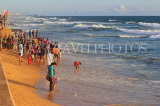 SRI LANKA, Colombo, Galle Face Green, people enjoying paddling on the beach, SLK5257JPL