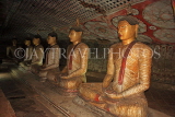 SRI LANKA, Dambulla Cave Temple (Golden Temple), row of seated Buddha statues in cave, SLK2805JPL