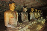 SRI LANKA, Dambulla Cave Temple (Golden Temple), row of seated Buddha statues in cave, SLK2862JPL