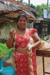 SRI LANKA, Kajugama (on Kandy Rd), Cashewnut vendor, traditional cloth and jacket dress, SLK2473JPL