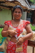 SRI LANKA, Kajugama (on Kandy Rd), Cashewnut vendor, traditional cloth and jacket dress, SLK2474JPL