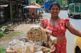 SRI LANKA, Kajugama (on Kandy Rd), Cashewnut vendor, traditional cloth and jacket dress, SLK2477JPL
