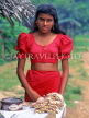 SRI LANKA, Kajugama (on Kandy Road), Cashewnut vendor, traditional cloth and jacket dress, SLK286JPL