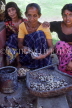 SRI LANKA, Kajugama (on Kandy Road), Cashewnut vendor removing nuts from shells, SLK363JPL