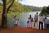SRI LANKA, Kandy, Kandy Lake, people enjoying the view, SLK3686JPL