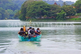 SRI LANKA, Kandy, Kandy Lake, people on boat tour, SLK3637JPL