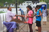 SRI LANKA, Kandy, Kandy lakeside, fruitseller, people buying Velvet Tamarind (Gal Siyambala), SLK3955JPL