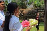 SRI LANKA, Kandy, Temple of the Tooth (Dalada Maligawa), site, woman with lotus flowers, SLK3328JPL