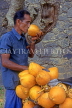 SRI LANKA, Kandy, man drinking Thambili (King Coconut Water), coconuts on bicycle, SLK1864JPL