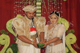 SRI LANKA, Kandy, traditional Kandyan Wedding, couple performing marriage rituals, SLK3813JPL