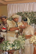 SRI LANKA, Kandy, traditional Kandyan Wedding, couple performing marriage rituals, SLK3814JPL