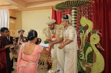 SRI LANKA, Kandy, traditional Kandyan Wedding, family members performing rituals, SLK4058JPL
