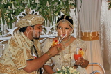 SRI LANKA, Kandy, traditional Kandyan Wedding, married couple having cocktails, SLK4072JPL