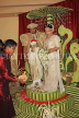 SRI LANKA, Kandy, traditional Kandyan Wedding, master of ceremonies with incense in coconut, SLK3730JPL