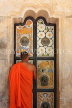 SRI LANKA, Kandy area, Asgiriya Monastery, monk openinig door to image house, SLK3194JPL