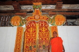 SRI LANKA, Kandy area, Degaldoruwa Cave Temple, Monk by the Dragon Arch, SLK5792JPL
