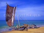 SRI LANKA, Negombo, fishermen pushing out catamaran (traditional fishing boat), SLK1613JPL