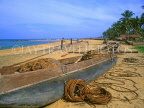 SRI LANKA, Negombo, fishing boat on beach, fishermen sorting out nets, SLK1548JPL