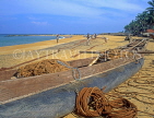 SRI LANKA, Negombo, fishing boat on beach, fishermen sorting out nets, SLK2056JPL